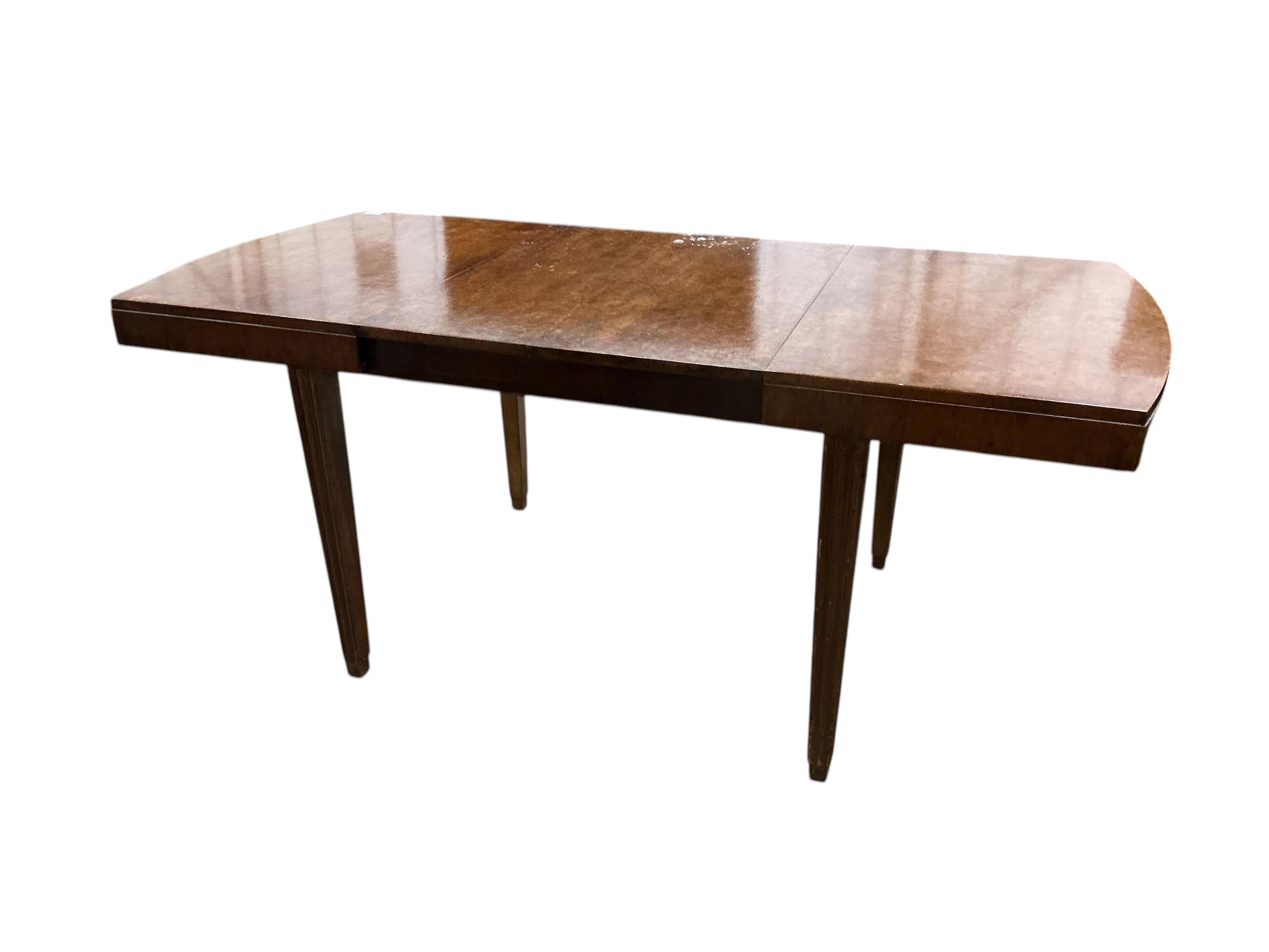 An Art Deco style beech and birds eye maple extending dining table, width 110cm, depth 84cm, height 75cm, and six similar chairs, two with arms